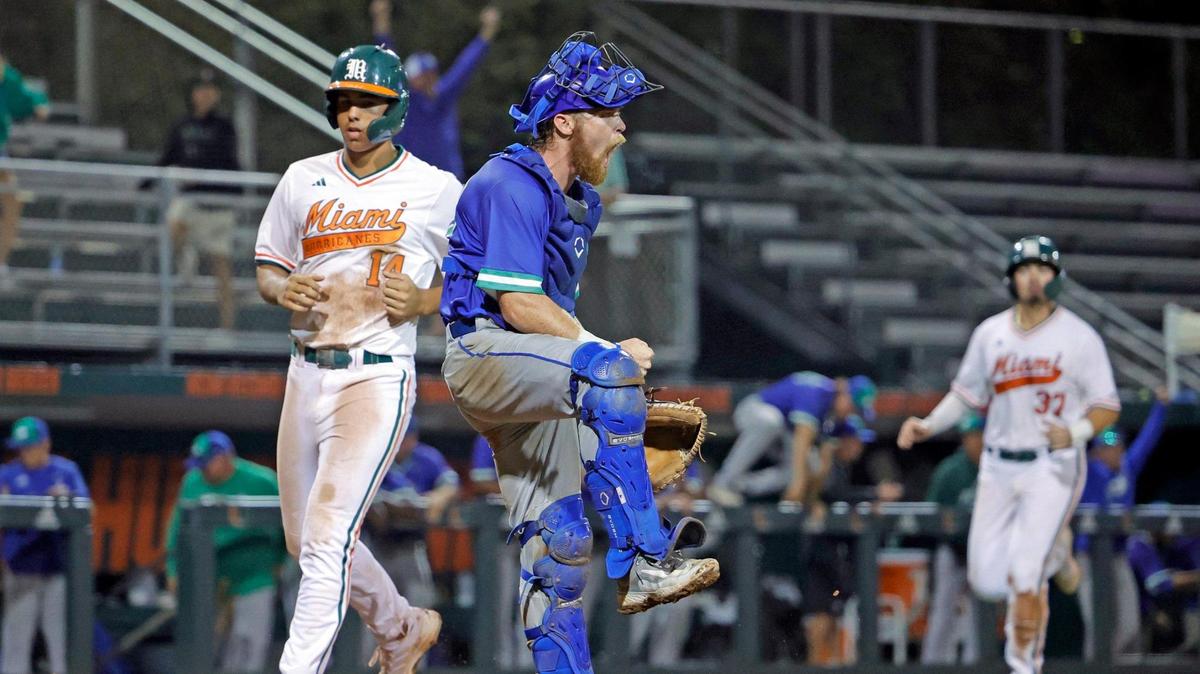 Florida Gulf Coast University catcher Mac Moise (20) reacts after Miami Hurricanes outfielder Jake Kulikowski (19) hits a pop fly for an out in the 12th inning at Alex Rodriguez Park at Mark Light Field in Coral Gables, Florida on Wednesday, February 28, 2024.