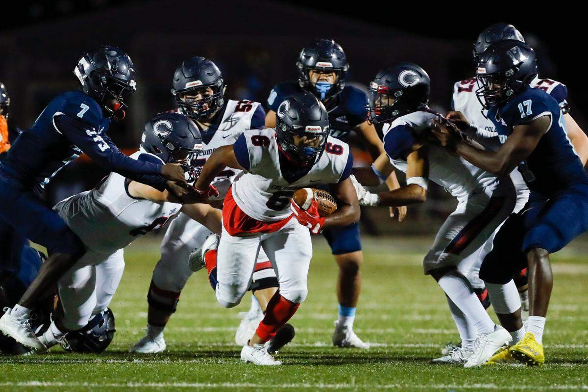 Columbus Explorers running back Denim Edwards (6) runs with the football against the Palmetto Panthers during the second half of the Region 4-Class 8A high school football championship game at Harris Field Park in Homestead, Florida, on Friday, November 26, 2021.
