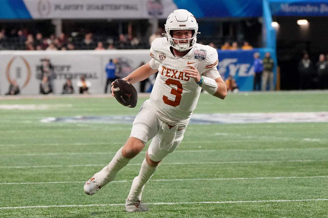 Jan 1, 2025; Atlanta, GA, USA; Texas Longhorns quarterback Quinn Ewers (3) runs with the ball for a touchdown against the Arizona State Sun Devils during the second half of the Peach Bowl at Mercedes-Benz Stadium.