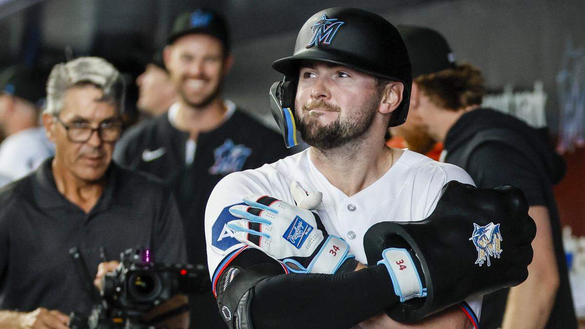 Miami Marlins catcher Liam Hicks (34) reacts in the dugout after hitting a homerun on a fly ball to right field bringing in Xavier Edwards (9) to score in the second inning against the Chicago White Sox at loanDepot Park in Miami, Florida, on Wednesday, April 1, 2026. 
