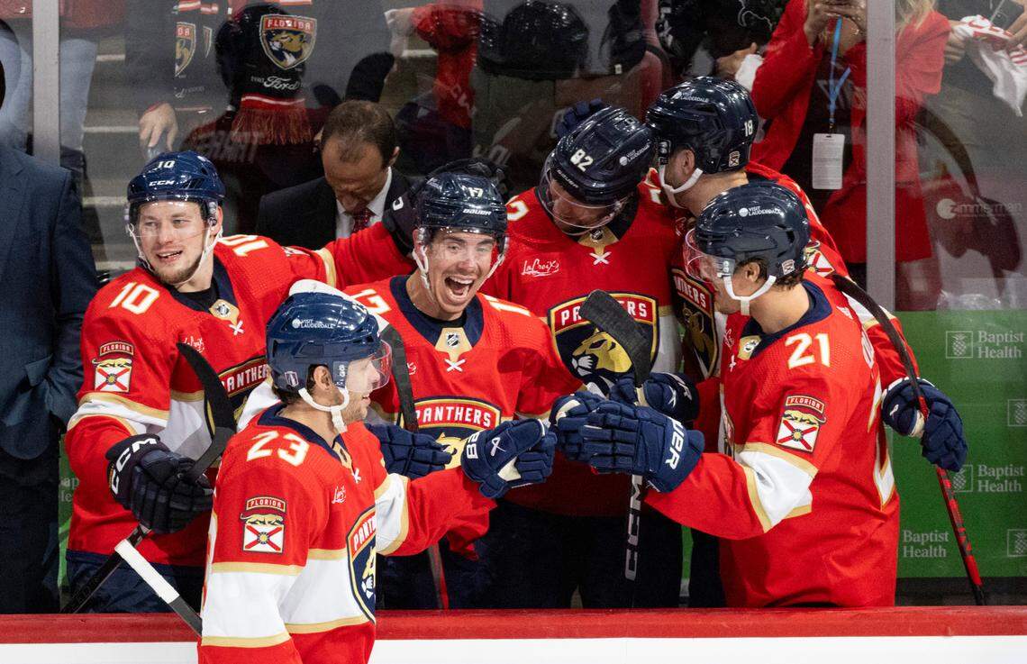 Florida Panthers center Carter Verhaeghe (23) highfives Florida Panthers center Evan Rodrigues (17) and other teammates after scoring a goal during the third period of Game 5 of Round 1 of the Stanley Cup Playoffs on Monday, April 29, 2024, at Amerant Bank Arena in Sunrise, Fla. The Florida Panthers won 6-1 and won the series.
