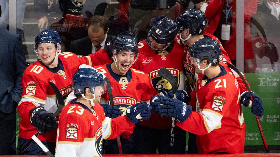 Florida Panthers center Carter Verhaeghe (23) highfives Florida Panthers center Evan Rodrigues (17) and other teammates after scoring a goal during the third period of Game 5 of Round 1 of the Stanley Cup Playoffs on Monday, April 29, 2024, at Amerant Bank Arena in Sunrise, Fla. The Florida Panthers won 6-1 and won the series.
