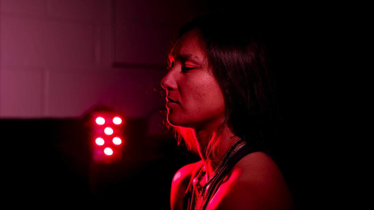 Kelsie Whitmore #3 of the Staten Island Ferryhawks uses red light therapy in her locker room at Richmond County Bank Ball Park on September 08, 2022 in Staten Island, New York.