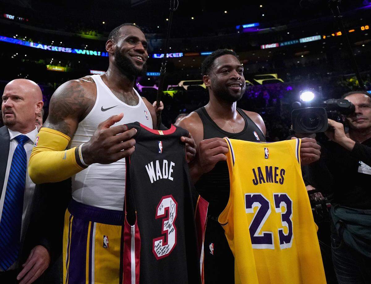 LeBron James #23 of the Los Angeles Lakers and Dwyane Wade #3 of the Miami Heat pose for a photo after exchanging jerseys, as Wade plans to retire at the end of the season, after a 108-105 Laker win at Staples Center on December 10, 2018 in Los Angeles, California.