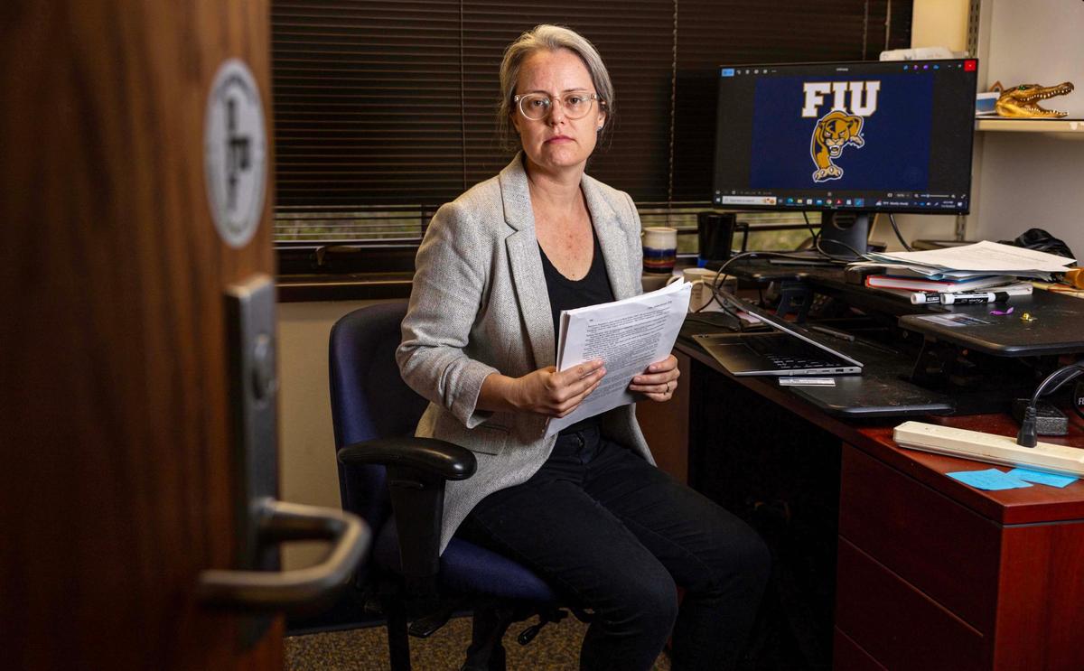Professor Katie Rainwater sits inside an office at Florida International University on Tuesday, Nov. 19, 2024, in Miami, Fla. Rainwater is a professor in the Global and Sociocultural Studies department and has spoken out against a state law which is limiting the kinds of courses that can be included in general education with the aim of getting rid of “liberal indoctrination in universities,” calling it censorship and political meddling.