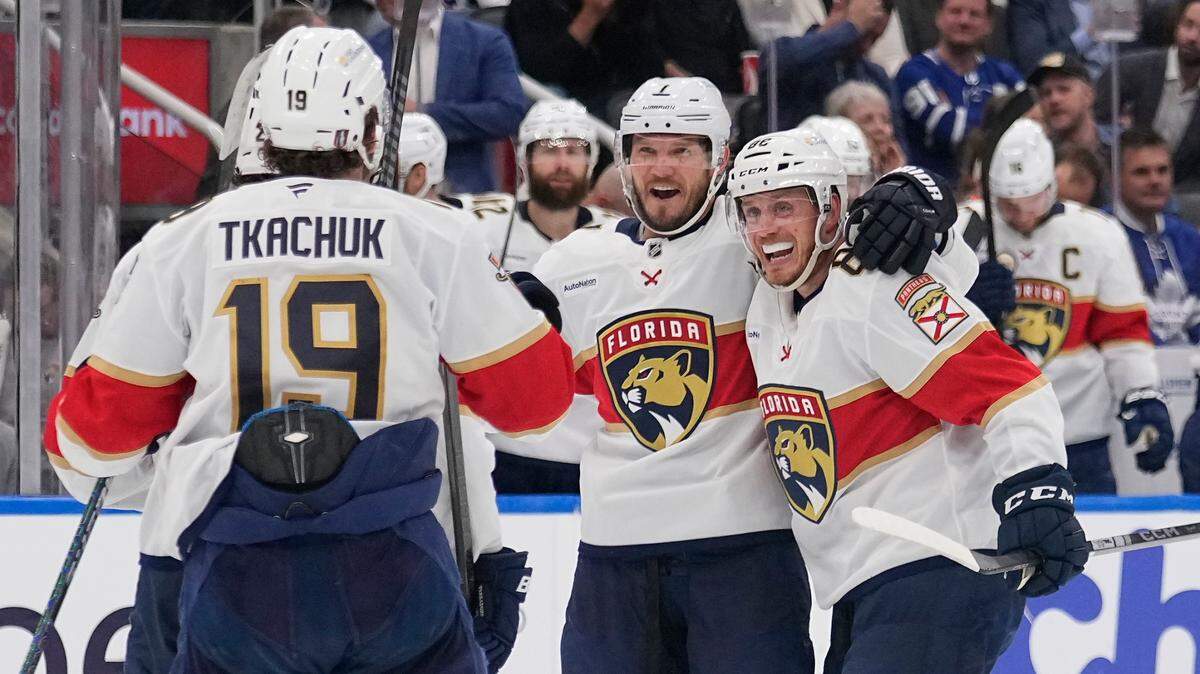 May 14, 2025; Toronto, Ontario, CAN; Florida Panthers defenseman Dmitry Kulikov (7) celebrates his goal against the Toronto Maple Leafs with defenseman Nate Schmidt (88) and forward Matthew Tkachuk (19) during the second period of game five of the second round of the 2025 Stanley Cup Playoffs at Scotiabank Arena. Mandatory Credit: John E. Sokolowski-Imagn Images