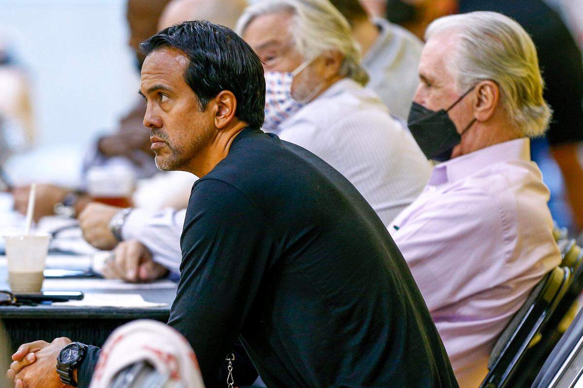 Miami Heat president Pat Riley, right, head Coach Erik Spoelstra, left, and team owner Micky Arison, center, watch the team during a practice scrimmage at FTX Arena in Miami on October 1, 2021.