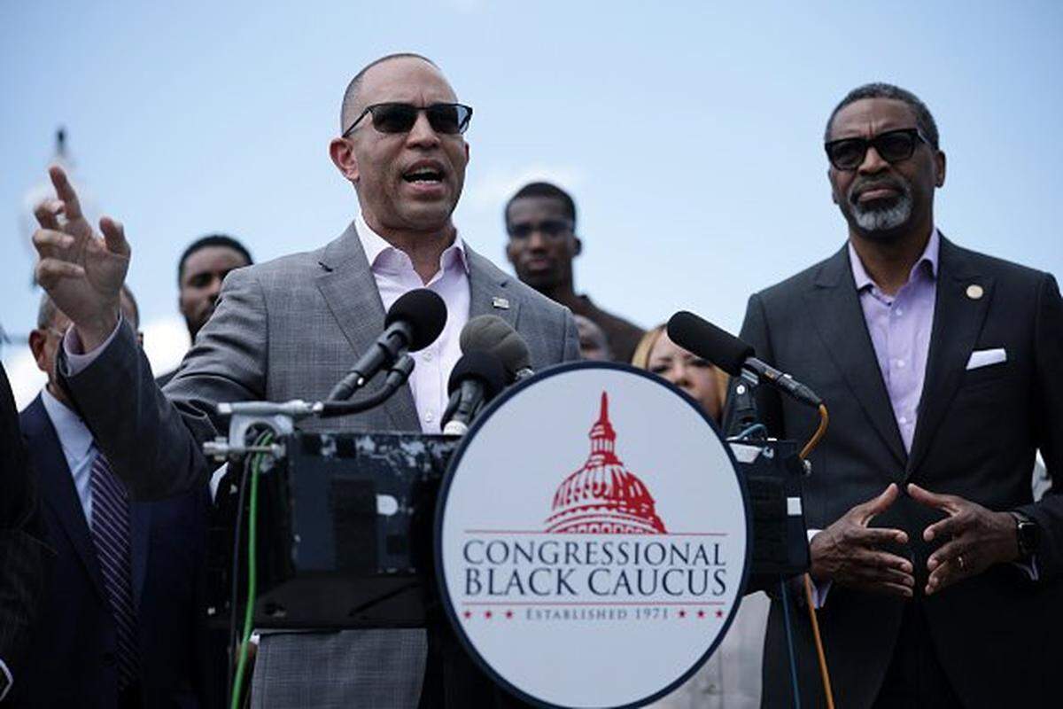 WASHINGTON, DC - MAY 19: U.S. House Minority Leader Hakeem Jeffries (D-NY) speaks as NAACP President Derrick Johnson (R) looks on during a news conference in opposition to the SCORE Act in front of the U.S. Capitol on May 19, 2026 in Washington, DC. The proposed federal SCORE Act (Student Compensation and Opportunity Through Rights and Endorsements Act) establishes a unified national framework for college sports and NIL compensation while protecting universities and the NCAA from antitrust lawsuits. (Photo by Alex Wong/Getty Images)