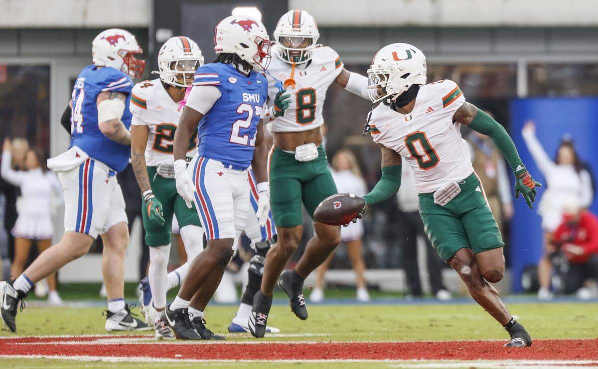 Miami Hurricanes defensive back Keionte Scott (0) recovers a Southern Methodist University Mustangs fumble in the first half during an NCAA football game at Gerald Ford Stadium on Saturday, November 1, 2025, in Dallas, Texas.