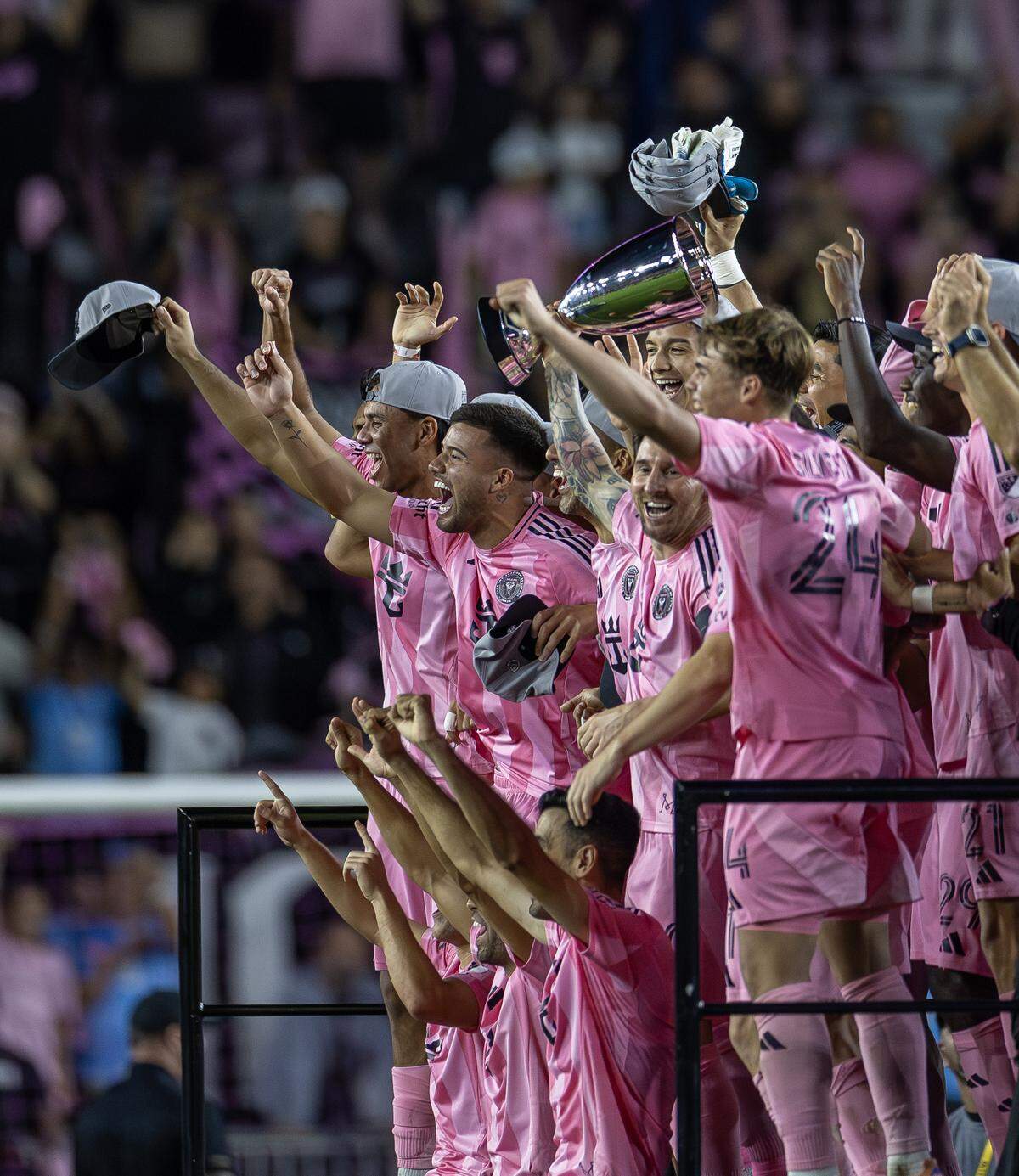 Inter Miami forward Lionel Messi (10) holds the Eastern Conference final trophy on stage as he celebrates with teammates after a 5-1 win over New York City FC in the MLS Eastern Conference final at Chase Stadium on Saturday, Nov. 29, 2025, in Fort Lauderdale, Fla. The victory sends Inter Miami to its first MLS Cup final.
