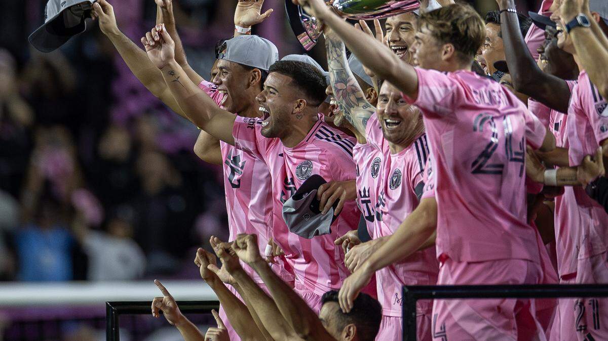 Inter Miami forward Lionel Messi (10) holds the Eastern Conference final trophy on stage as he celebrates with teammates after a 5-1 win over New York City FC in the MLS Eastern Conference final at Chase Stadium on Saturday, Nov. 29, 2025, in Fort Lauderdale, Fla. The victory sends Inter Miami to its first MLS Cup final.