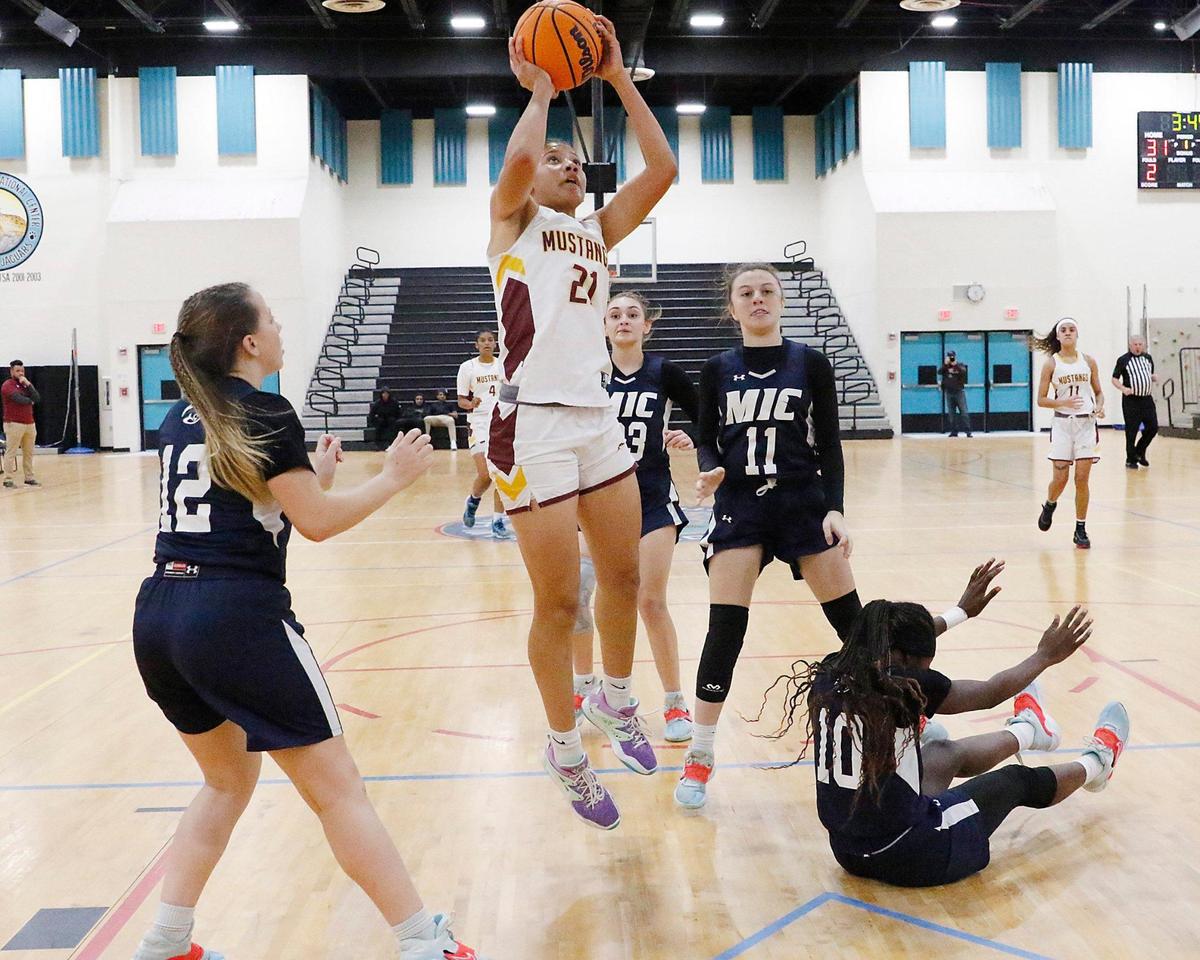 Horeb Christian Emely Rodriguez (21) goes for a shot against Merritt Island Christian during the 2023 Girls Basketball Tournament-2A on Thursday, February 9, 2023 at Miami Lakes Educational Center in Miami Lakes. Andrew Uloza / for Miami Herald