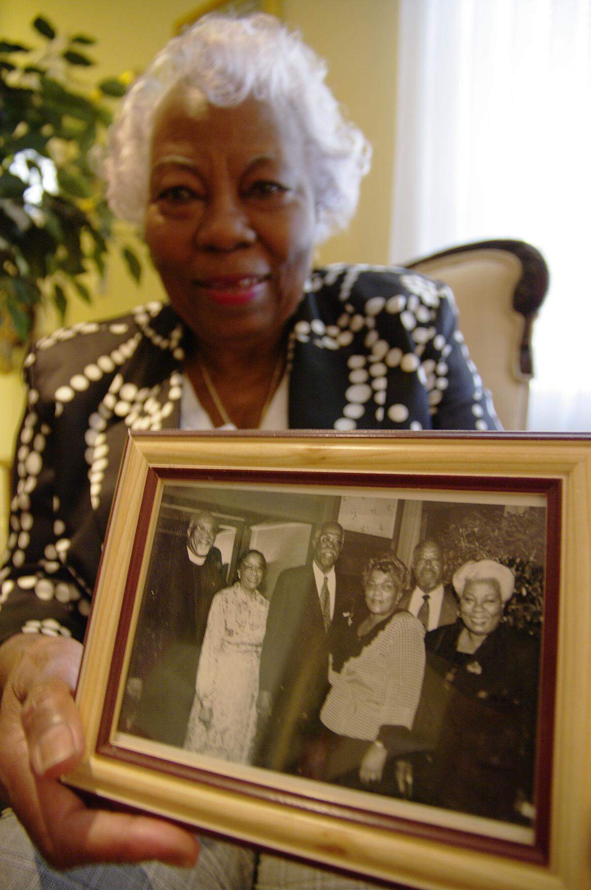 Leona Cooper holds a picture of some of her family members on March 1, 2010.  
