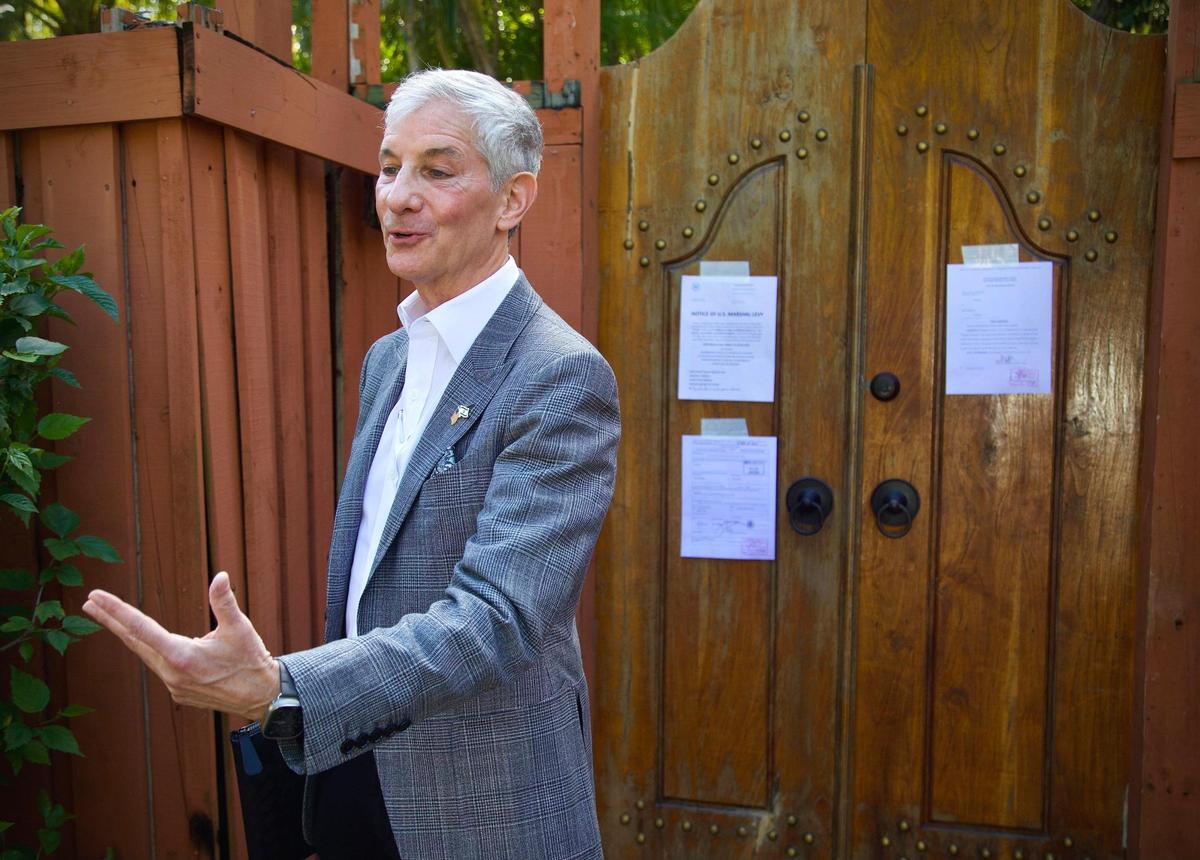 Marc Sarnoff speaks to reporters outside Joe Carollo’s residence in Coconut Grove on Friday, Feb. 2, 2024. U.S. Marshals began the process necessary to seize the property after Carollo lost a civil trial accusing him of misusing his public office, but a judge later said the home was protected under Florida law.