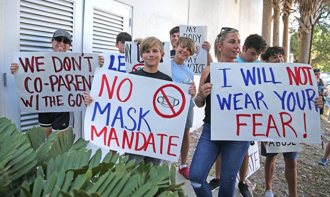 An anti-mask contingent protests while inside the Broward County School Board holds a hearing to determine if they will impose a mask mandate for the upcoming school year, Fort Lauderdale, Florida, August 10, 2021.