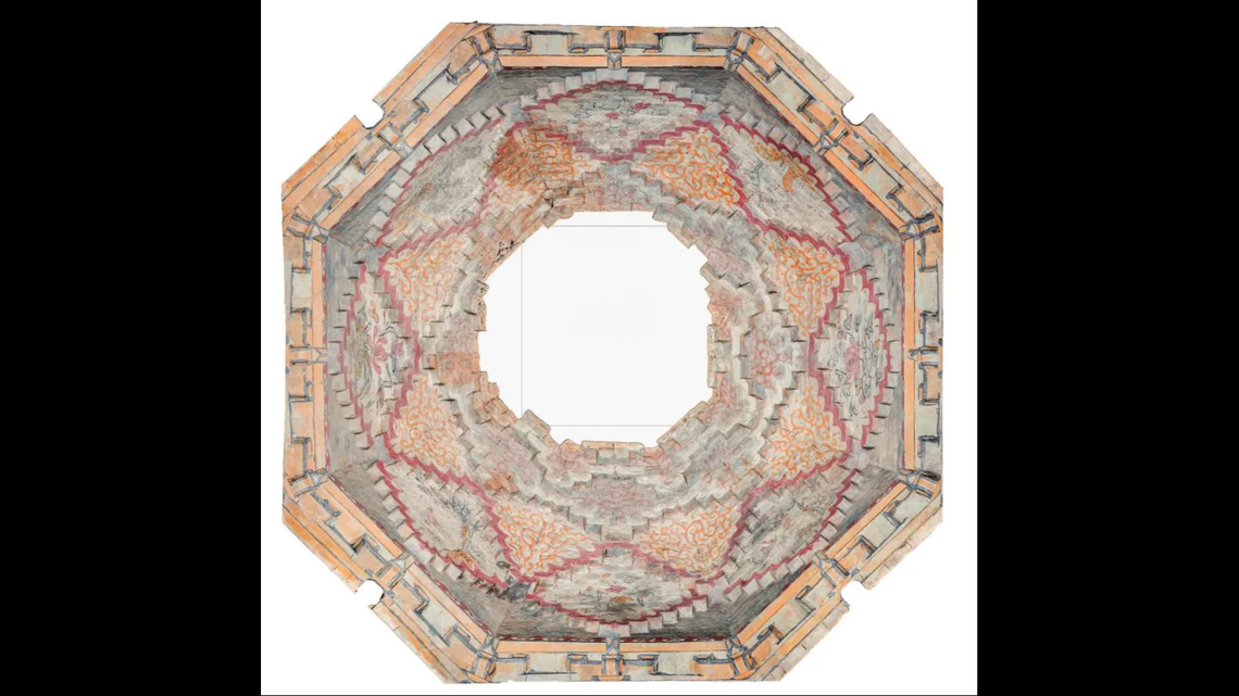 The ceiling, which was partially damaged, is painted with elaborate murals.