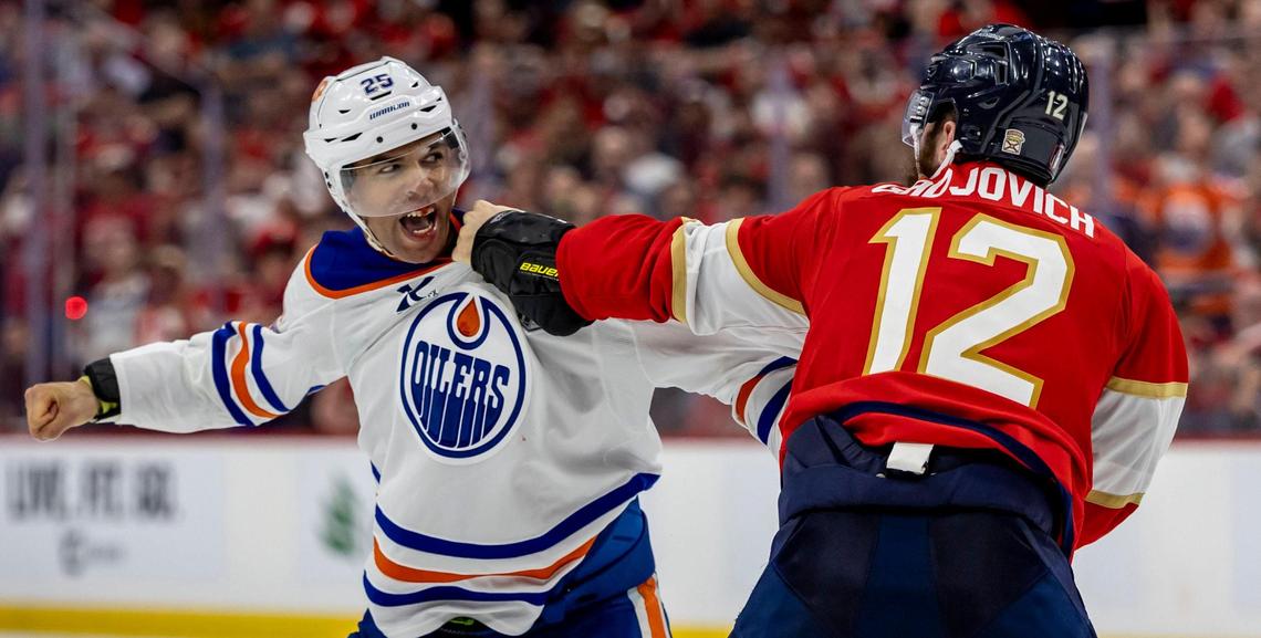 Edmonton Oilers defenseman Darnell Nurse (25) left fights with Florida Panthers left wing Jonah Gadjovich (12) during the third period of Game 3 in the NHL Stanley Cup Final series at Amerant Bank Arena on Monday, June 9, 2025, in Sunrise, Fla.