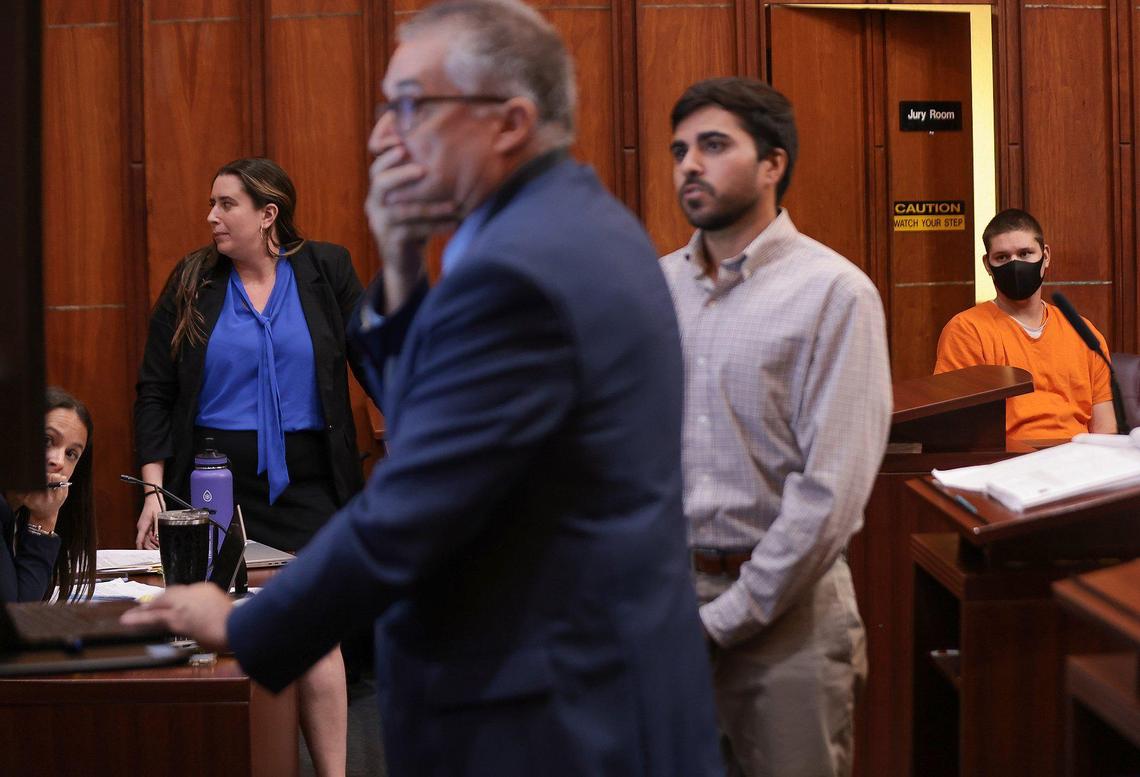 On Monday. Nov. 7, 2022, Christopher Monzon, the Republican canvasser beaten in Hialeah, gets a closer look at the screen as the State presented its case during Javier Lopez’s hearing in Courtroom 4-5 in front of Judge Zachary N. James at the Richard E. Gerstein Justice Building in Miami, Florida. Left to right: Assistant State Attorney Santiago Aroca Christopher Monzon, and Javier Lopez, right.
