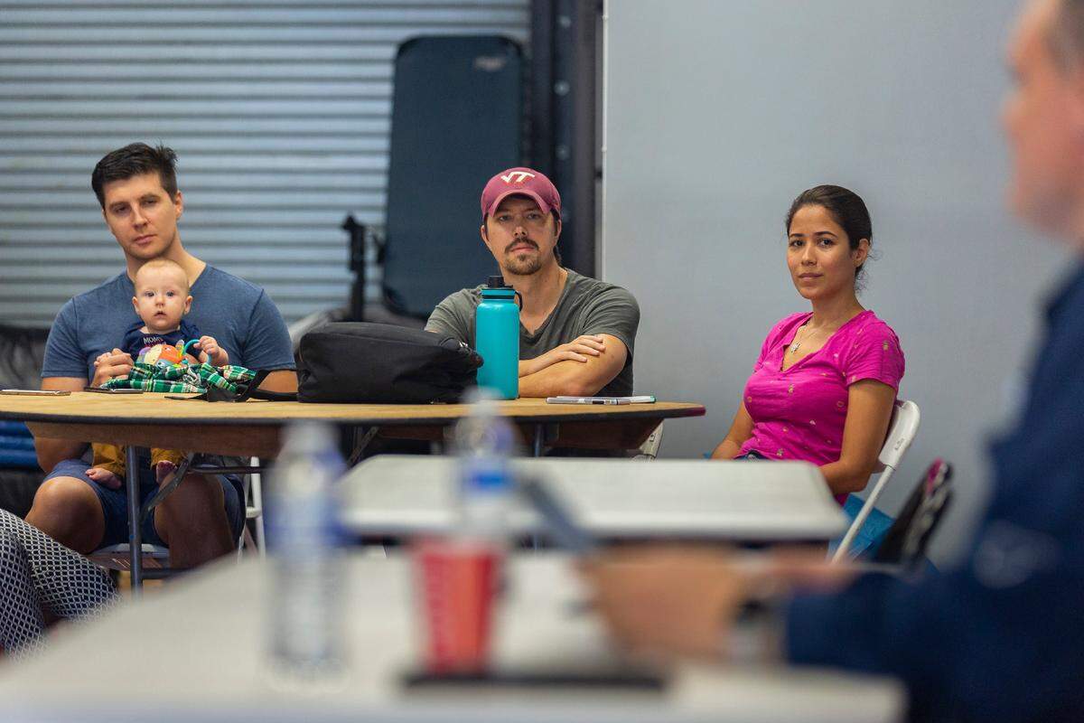 From left to right: Alex Akulov, Will Kline and Maryanna Ovalle attend a free meetup group for Amazon resellers in Miami on Saturday, December 15, 2018. The free Meetup aims to teach members how to successfully launch and sustain a business selling items on Amazon.