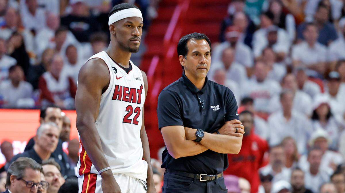 Miami Heat forward Jimmy Butler (22) and coach Erik Spoelstra look across the court during the second quarter in a game against the Boston Celtics in Game 4 of the NBA Eastern Conference Finals at Kaseya Center in Miami on May 23, 2023.