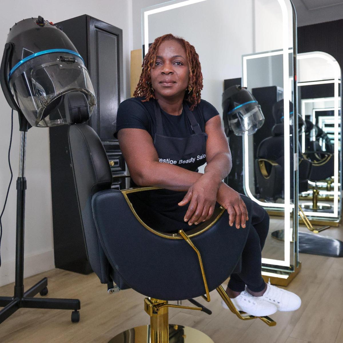 Hairstylist and beautician Nicole Ward sits at Prestige Beauty Salon at Cloverleaf Plaza in Miami Gardens, which she says has improved under its new ownership. “It’s 100 percent better than before, it’s well kept. We have security guards,” she said.