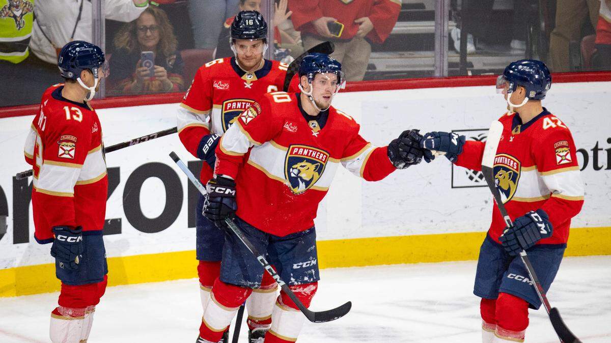 Florida Panthers defenseman Gustav Forsling (42) fist bumps right wing Vladimir Tarasenko (10) after Tarasenko scores during the third period of a hockey game on Thursday, April 11, 2024, at Amerant Bank Arena in Sunrise, Fla. The Panthers won 4-0.