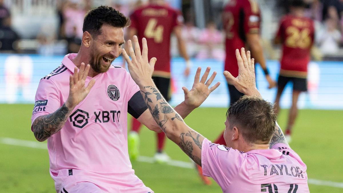 Inter Miami forward Lionel Messi (10) celebrates with Inter Robert Taylor (16) after scoring a second goal against Atlanta United in the first half of their Leagues Cup group stage match at DRV PNK Stadium on Tuesday, July 25, 2023, in Fort Lauderdale, Fla.