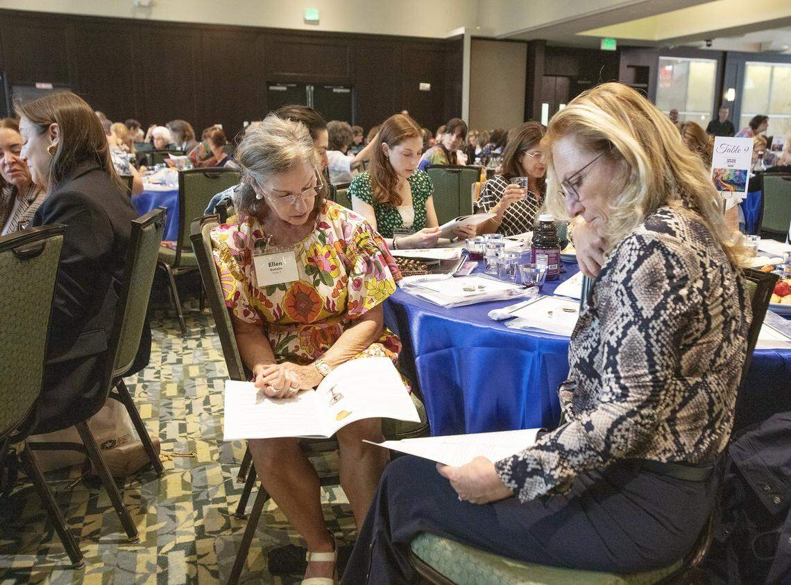 Women participating in the Third Annual South Dade Community Women's Passover Seder read Passover Haggadah on Sunday, March 30, 2026 at Temple Judea in Coral Gables. Andrew Uloza / for Miami Herald