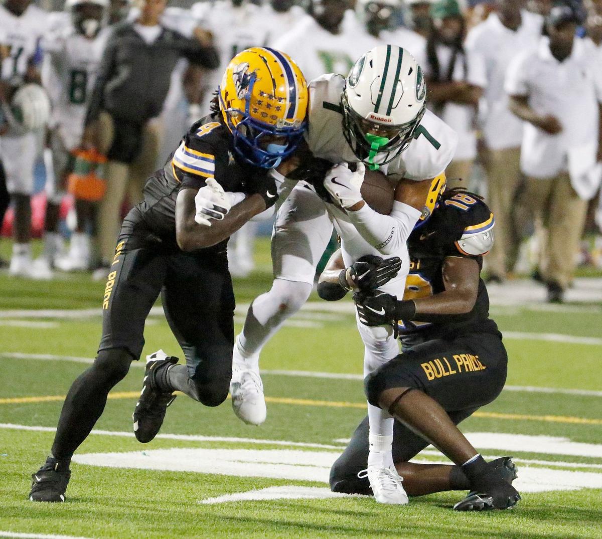 Miami Central Rockets wide receiver Nae’shaun Montgomery (7) is taken down by Northwestern Bulls defenders during football game on Friday, October 4, 2024 at Traz Powell Stadium in Miami. Andrew Uloza / for Miami Herald