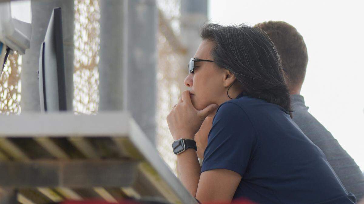 Miami Marlins general manager Kim Ng watches a game between Marlins and Washington Nationals minor league players on the back fields of the Roger Dean Chevrolet Stadium on Thursday, March 10, 2022, in Jupiter, Florida.
