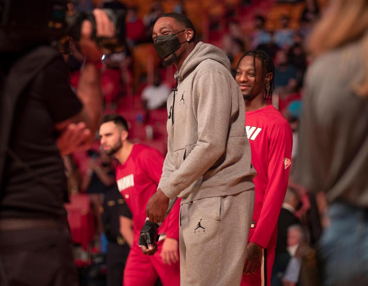 Injured Miami Heat center Bam Adebayo (13) walks out on the court before the game against the Chicago Bulls at the FTX Arena in Miami on Saturday, December 11, 2021.