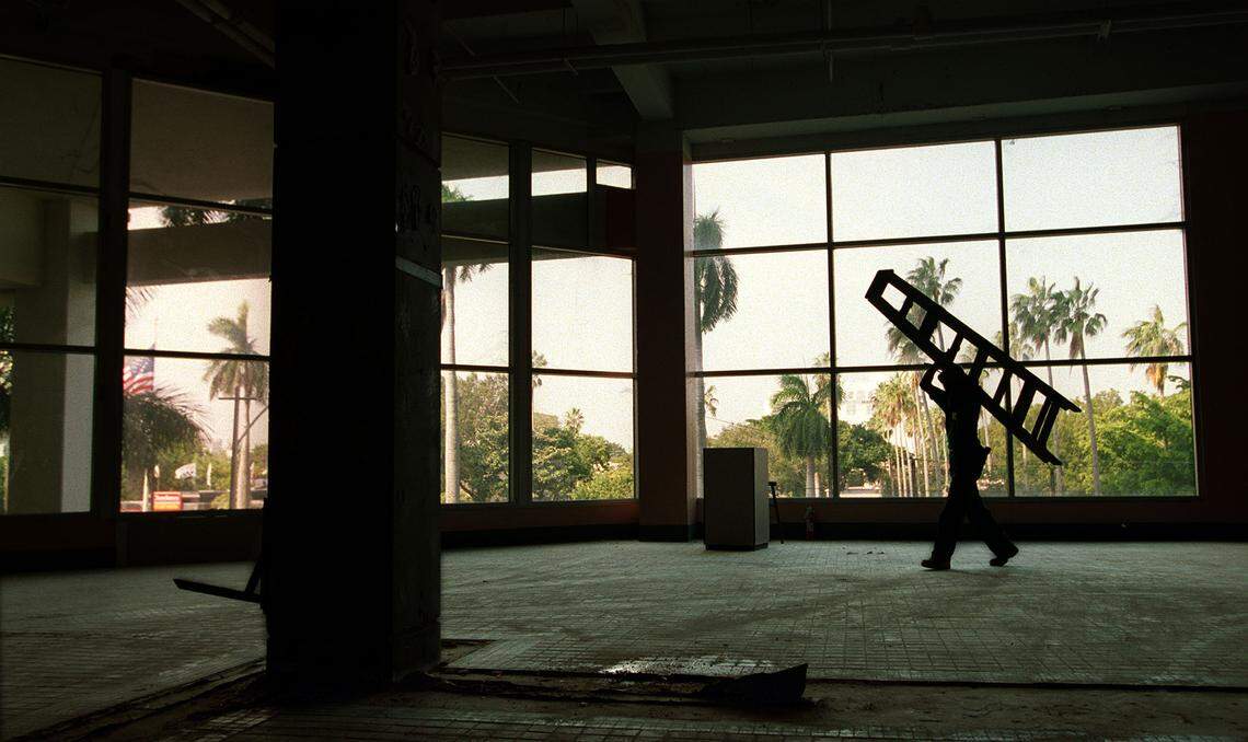 Construction workers in the former Omni mall’s ‘food court, under conversion to the Omni Technology Center. The former mall offered a million square feet to high-tech vendors.
