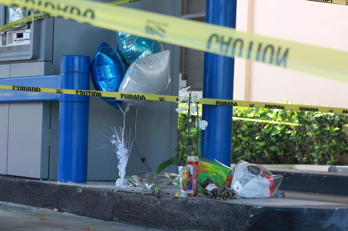 A memorial was created at a West Kendall Chase Bank where two adults and a child were killed in a murder suicide.
