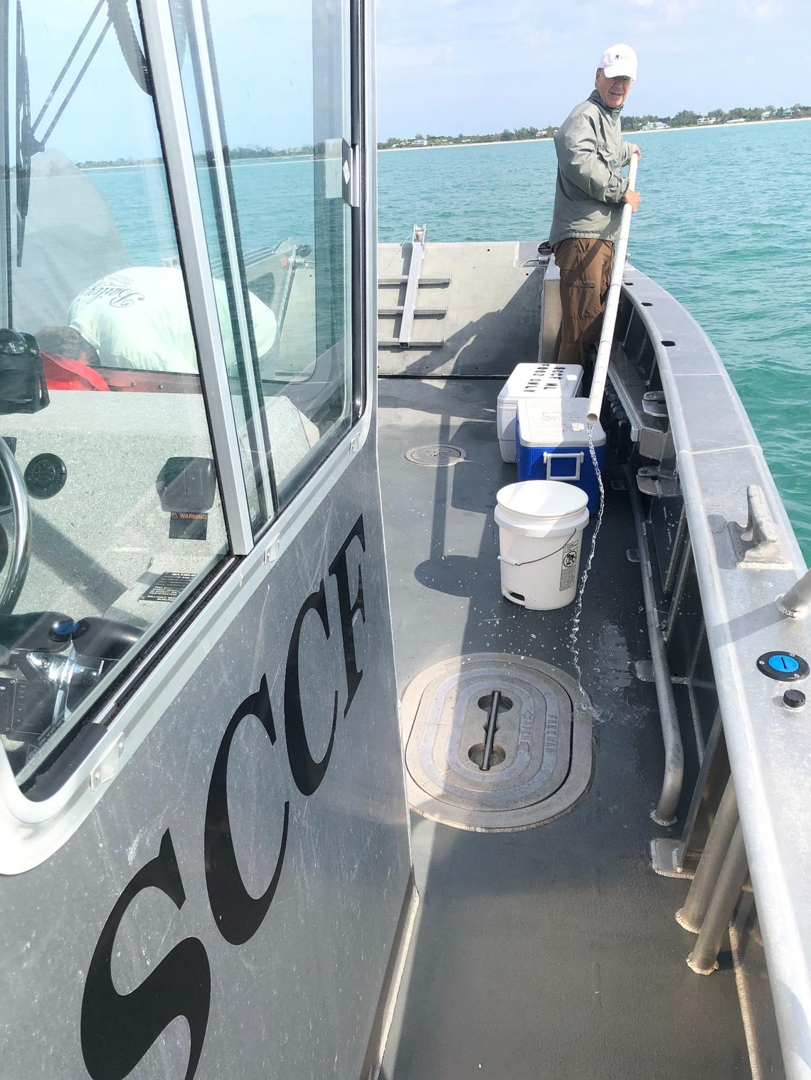 Sanibel Captiva Conservation Foundation research associate Mark Thompson collects water-quality samples.