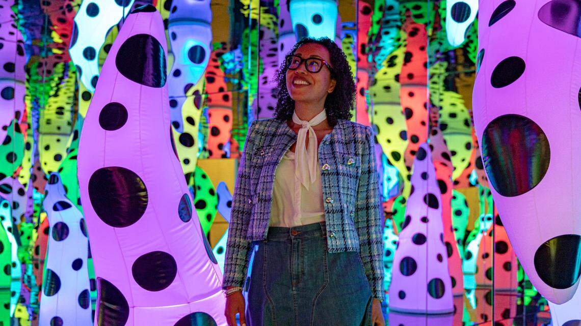 Yayoi Kusama’s ‘LOVE IS CALLING’ is a darkened, mirrored room illuminated by glowing inflatable tentacles.