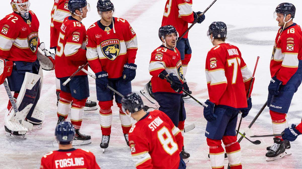 Florida Panthers center Brad Marchand (63) celebrates with his teammates after they defeated the Utah Hockey Club in the overtime period of their NHL game at Amerant Bank Arena on Friday, March 28, 2025, in Sunrise, Fla.