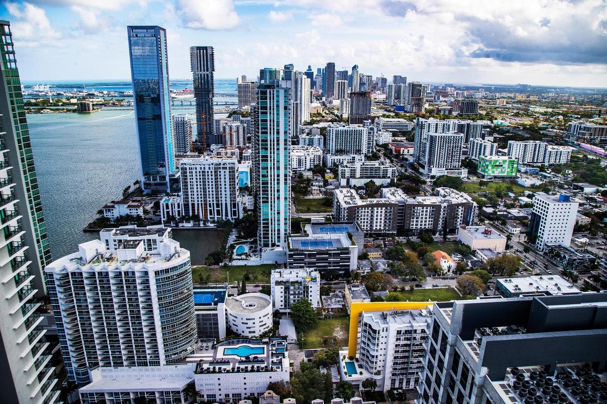 This is a south view of the Miami skyline from the rooftop pool area at Paraiso Bay Views condo building in Miami’s Edgewater neighborhood. Santiago Rodriguez and his wife Alicia Teodoro bought a one-bedroom home there.