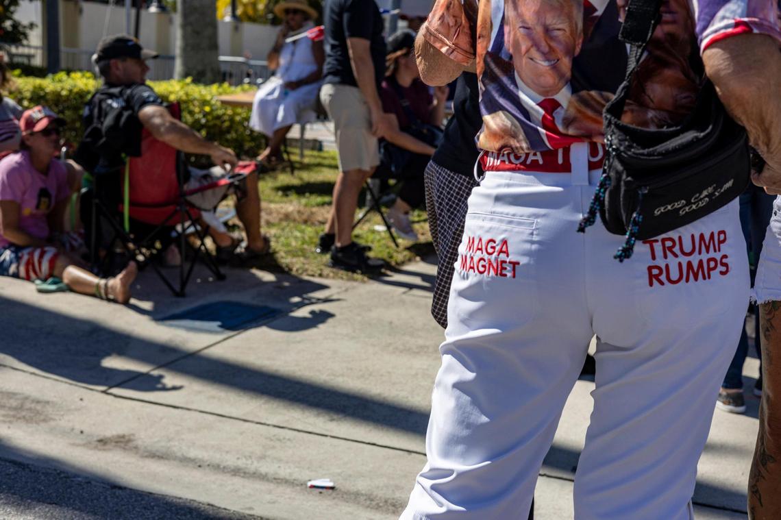 A Trump supporter promotes her love of the former president on her rump. On the night of the RNC debate in Miami, former President Donald Trump holds a rally in Hialeah.