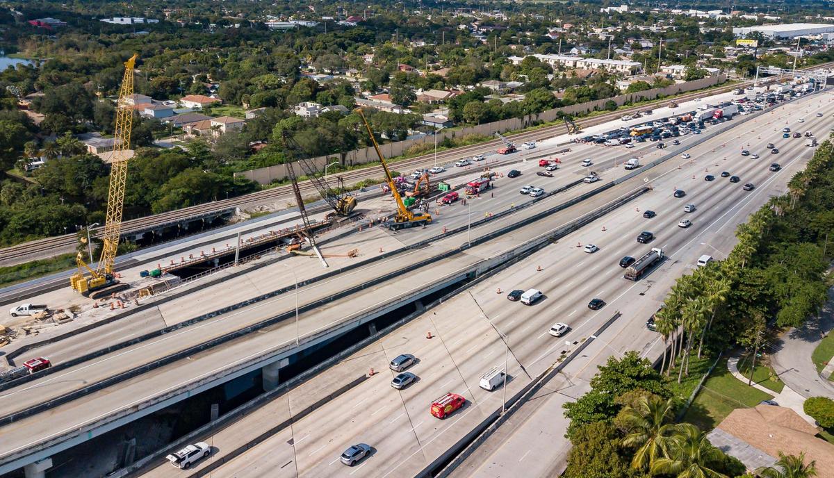 A concrete pilling sits on a collapsed travel lift blocking southbound traffic on Interstate 95 between Sunrise Boulevard and Broward Boulevard on Monday, Dec. 5, 2022, in Fort Lauderdale, Fla. The incident resulted in injuries to two construction workers who were transported to Broward Health, according to the Florida Highway Patrol.