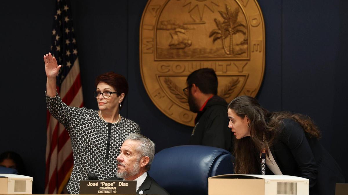 Commissioner Rebeca Sosa, and Chairman Jose “Pepe” Diaz, center, at a May 2022 board meeting. The 2023 budget contains compensation increases for the board. Diaz voted against the ordinance that includes the pay increases. The pay increases require a second vote before going into effect on Oct. 1, 2022.