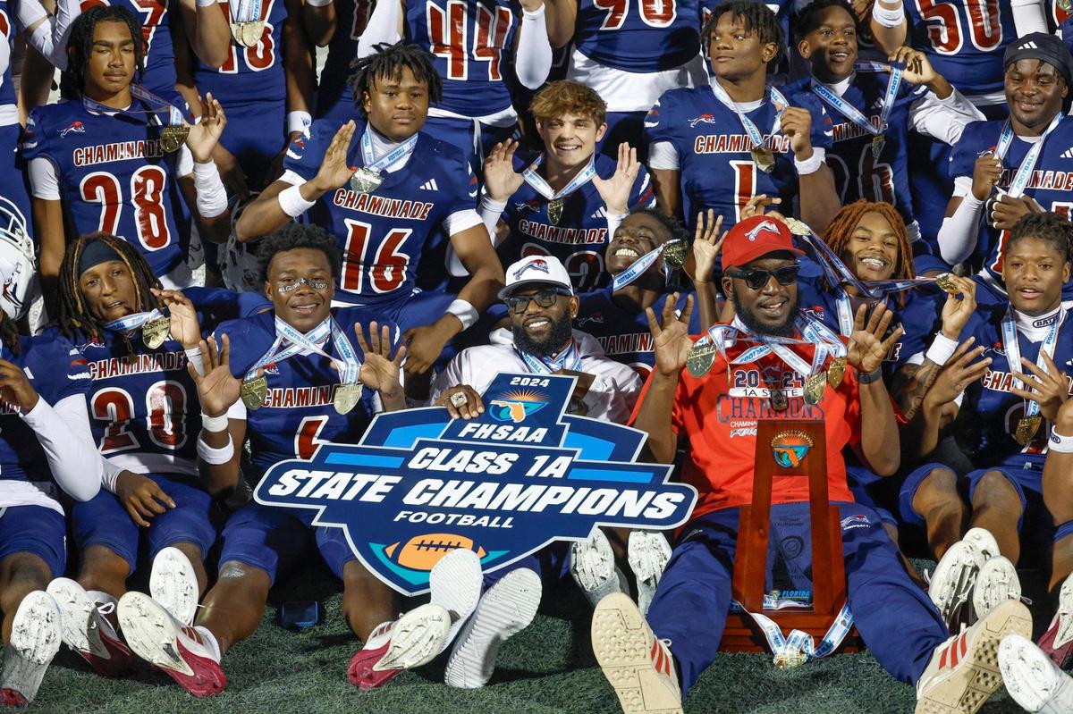 Chaminade-Madonna players and coaches celebrate their State Championship after defeating Clearwater Central Catholic in the Florida High School Football State Championships - Class 1A game at Pitbull Stadium on the campus of Florida International University in Miami, Florida, on Wednesday, December 11, 2024.