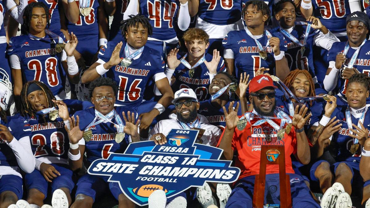 Chaminade-Madonna players and coaches celebrate their state championship after defeating Clearwater Central Catholic in the Florida High School Football State Championships - Class 1A game at Pitbull Stadium on the campus of Florida International University in Miami, Florida, on Wednesday, December 11, 2024.