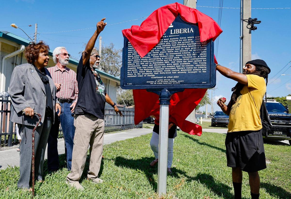 Liberia, a historically Black community in Hollywood, Florida, received a state historical marker to commemorate Liberia’s history on Saturday, Feb. 15, 2025. Unveiling the marker is Earl Beneby, left, and Emmanuel George, right.