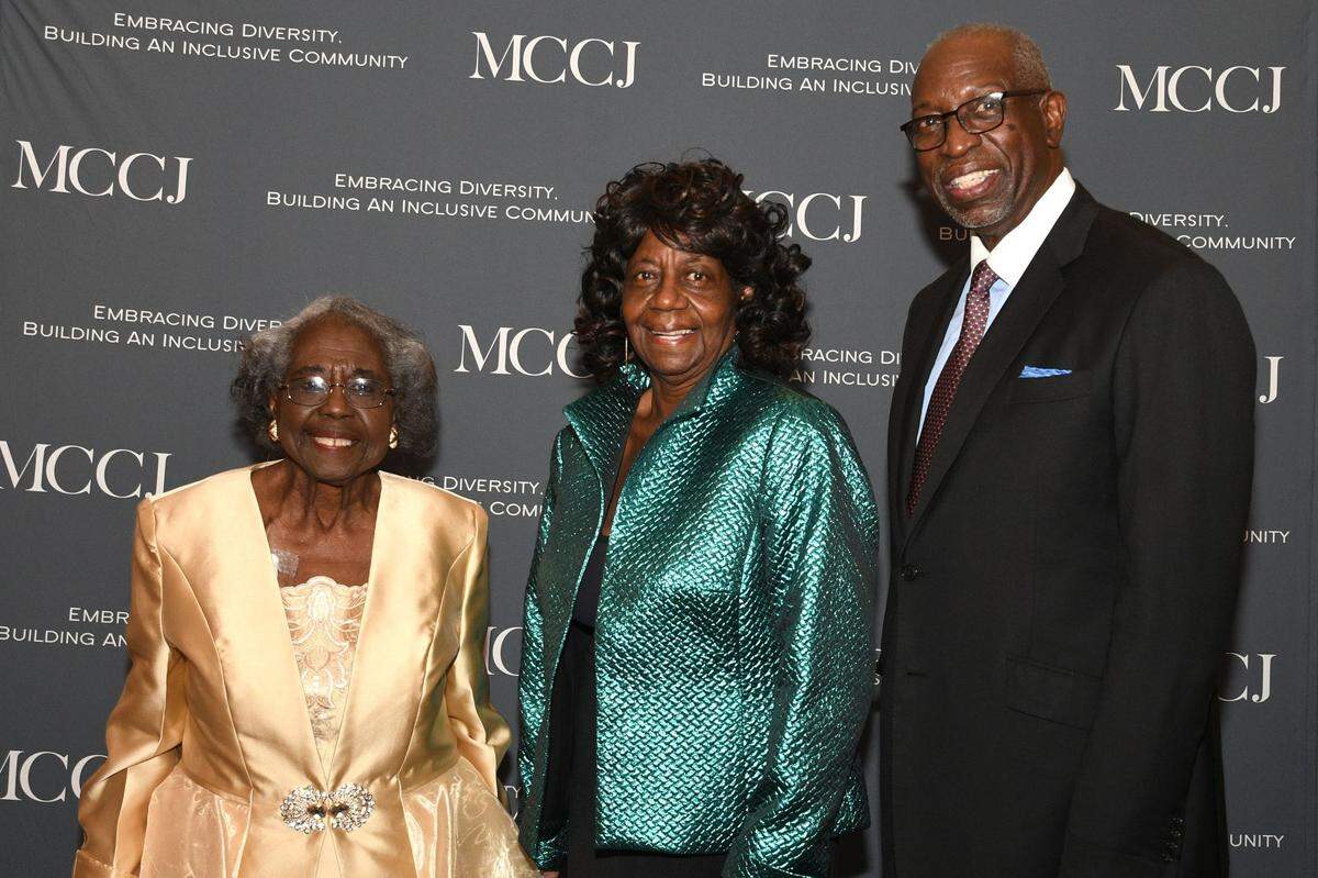On Feb. 27, the Miami Coalition of Christians and Jews honored seven Miami-Dade Countians, including Dr. Enid C. Pinkney, left, and the Rev. Dr. Walter T. Richardson, right. They are conversing with archivist and Neighbors contributor Dr. Dorothy J. Fields, center, who is a past MCCJ honoree.