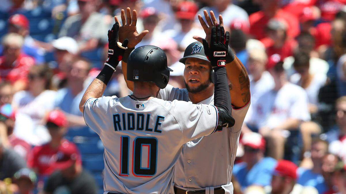 Miami Marlins’ JT Riddle is congratulated by Cesar Puello #46 after hitting a two-run home run against the Philadelphia Phillies during the second inning of a baseball game at Citizens Bank Park on June 23, 2019 in Philadelphia.
