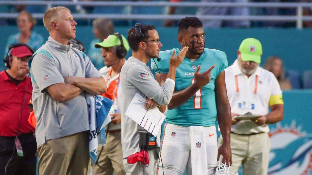 Miami Dolphins head coach Mike McDaniel with quarterback Tua Tagovailoa (1) on the sidelines during a timeout against the Philadelphia Eagles in the first quarter at Hard Rock Stadium in Miami Gardens on Saturday, August 27, 2022.
