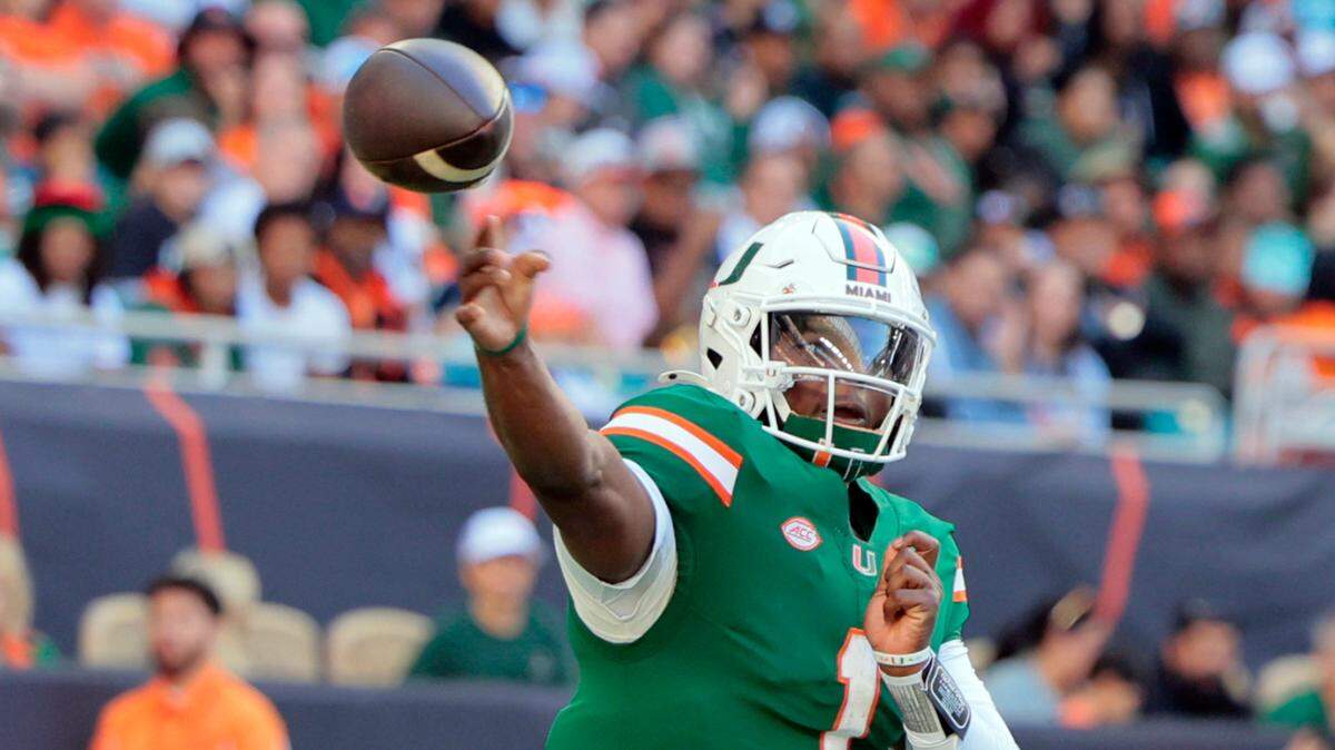 Miami Hurricanes quarterback Cam Ward (1) sets up to pass in the second half of their NCAA game in Miami Gardens, Florida, on Saturday, November 23, 2024.