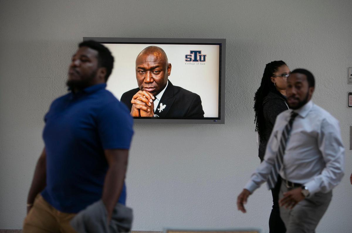 A photo of social justice attorney Ben Crump is displayed on a screen at St. Thomas University School of Law in Miami Gardens, Thursday Dec. 2, 2021, where an announcement was made about the new Benjamin L. Crump Center for Social Justice.