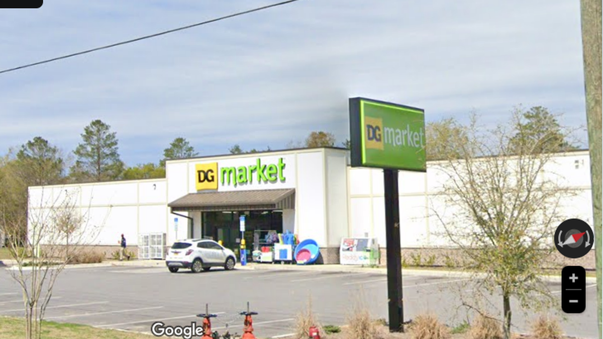 Deputy Will May was escorting a man out of this Dollar General store when a gunfight erupted, killing both men, Florida officials say.