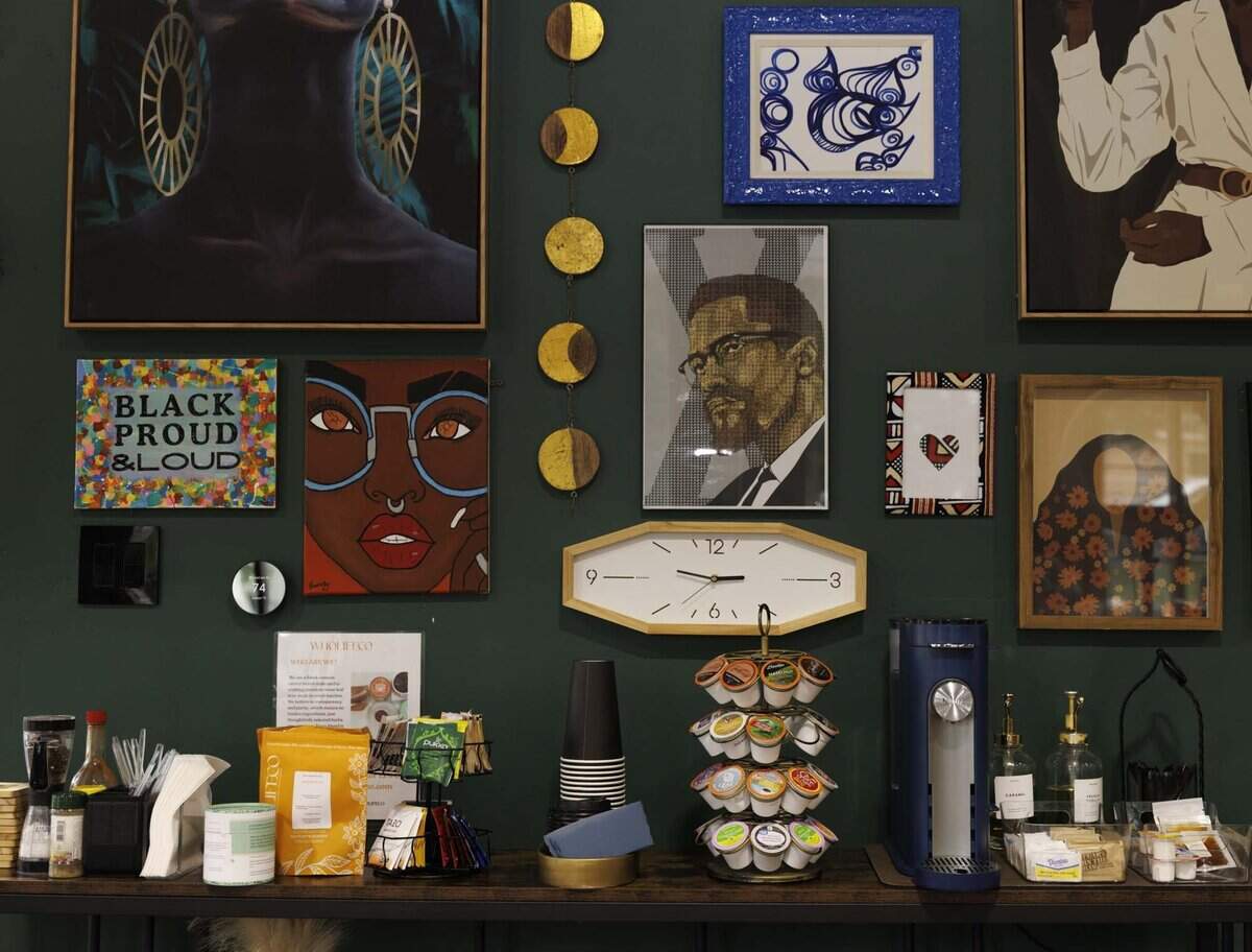 The coffee station and art collection of founder Joy St. Clair at Co-Space, a coworking space with a podcast studio and private meetings rooms, on Wednesday, June 3, 2026, in Miami Gardens, Fla.